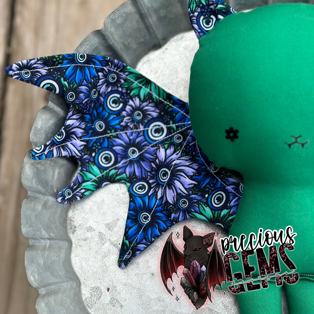 Evil eye floral bat doll